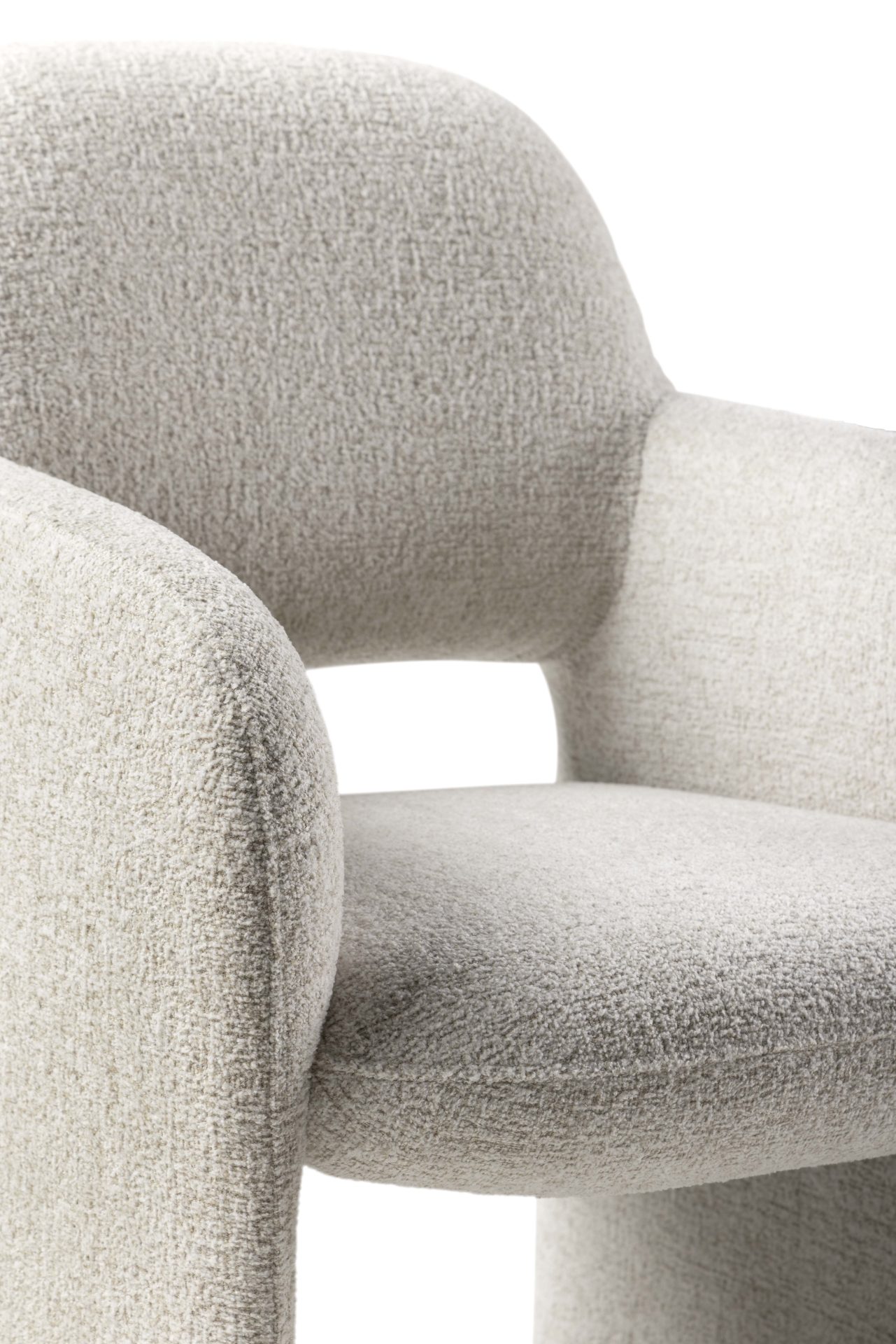 Leolux Modin met zachte rondingen en structuurstof Detail van de Leolux Modin eetkamerfauteuil met lichte stoffen bekleding